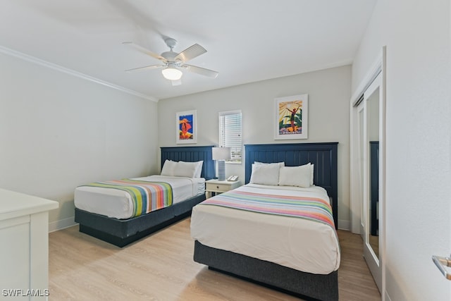 bedroom featuring a closet, ceiling fan, and light hardwood / wood-style floors