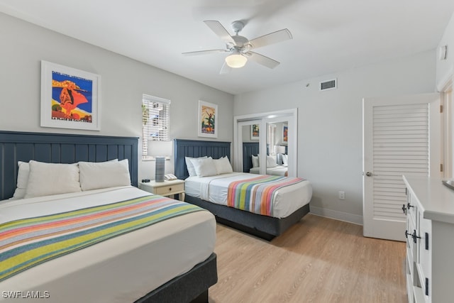 bedroom featuring light hardwood / wood-style flooring and ceiling fan