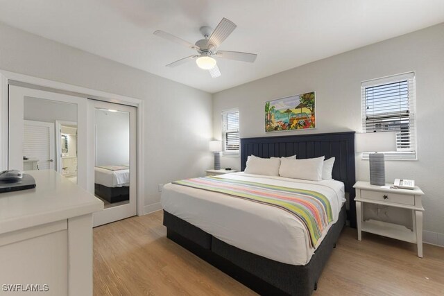 bedroom featuring light wood-type flooring and ceiling fan