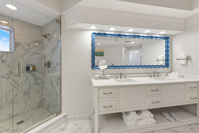 bathroom with vanity and a shower with shower door