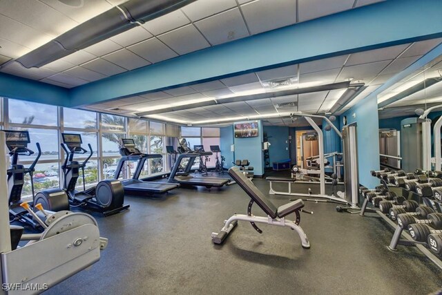 exercise room featuring a drop ceiling