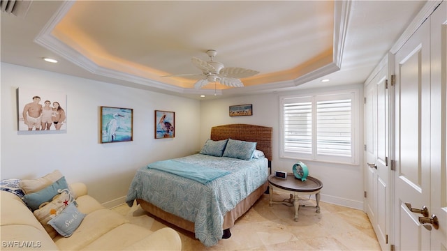 bedroom with ceiling fan, crown molding, and a tray ceiling