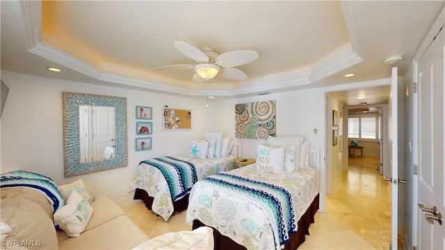 bedroom with ceiling fan, a raised ceiling, and crown molding