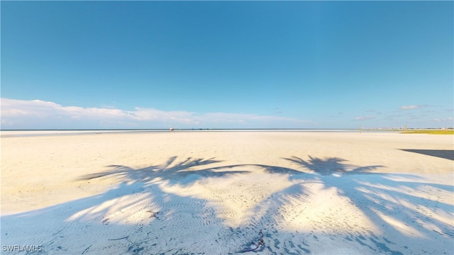 view of water feature with a beach view