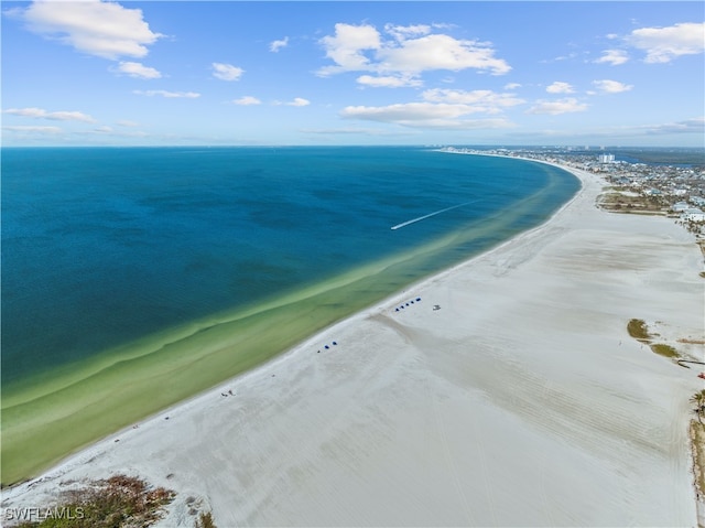 bird's eye view featuring a view of the beach and a water view