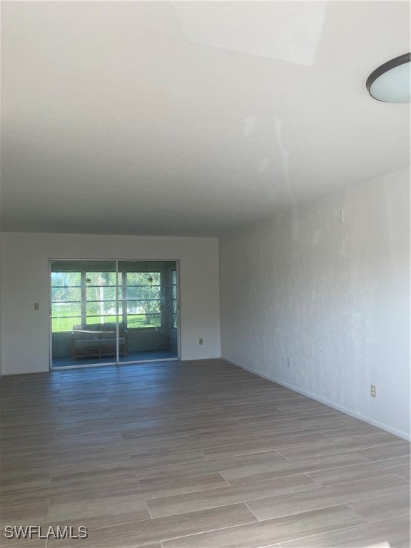 unfurnished room with light wood finished floors