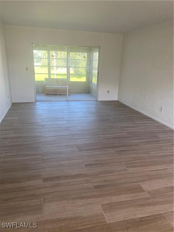 empty room featuring wood finished floors