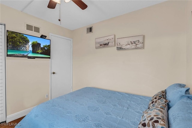 bedroom featuring hardwood / wood-style floors and ceiling fan