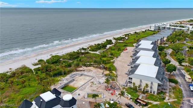 aerial view featuring a water view and a beach view