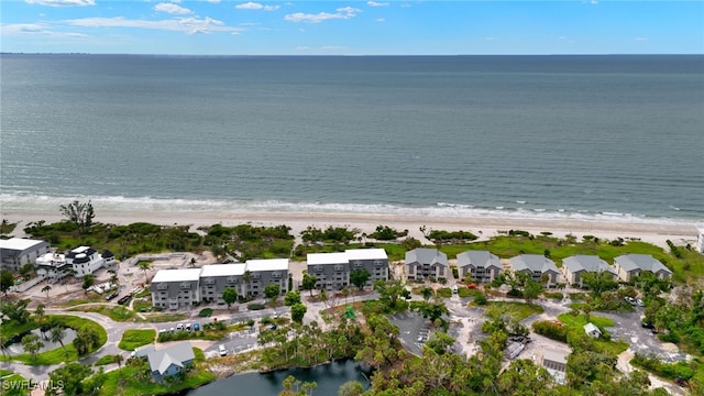 drone / aerial view featuring a view of the beach and a water view