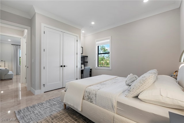 bedroom featuring a closet and ornamental molding