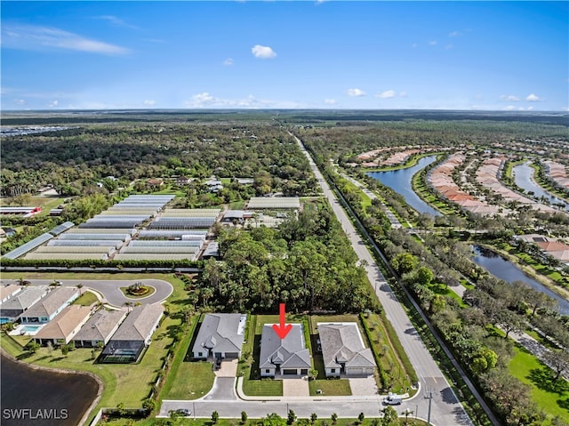 drone / aerial view with a water view