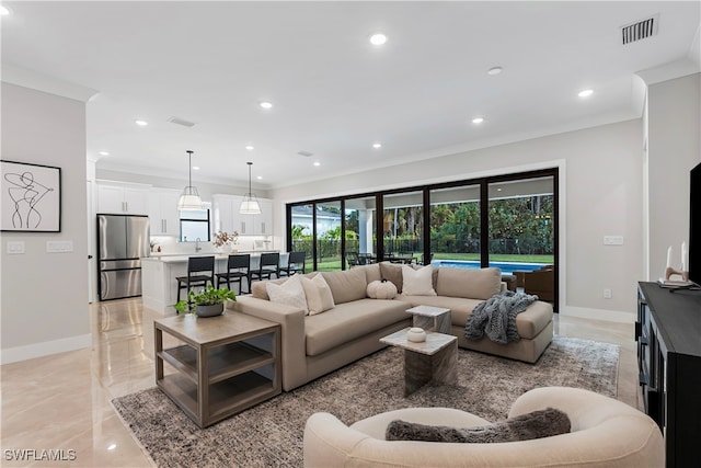 living room featuring crown molding