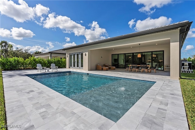 view of pool featuring a patio area