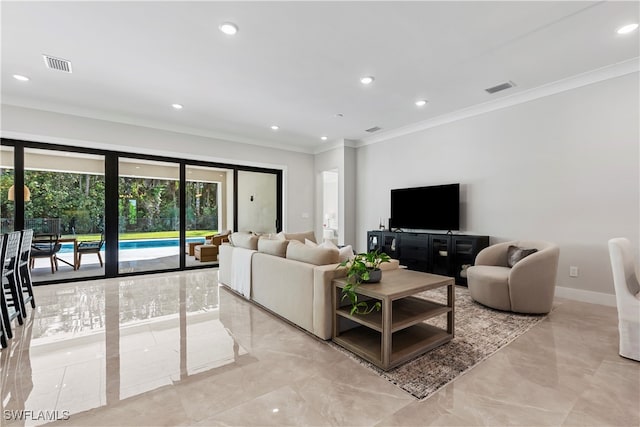 living room featuring crown molding