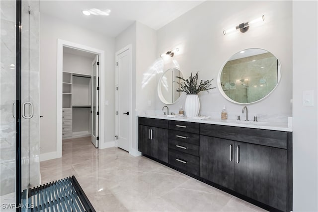 bathroom featuring vanity and a shower with shower door