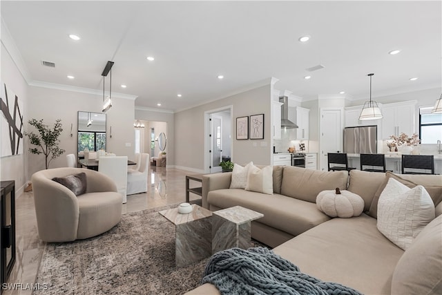 living room featuring ornamental molding and plenty of natural light