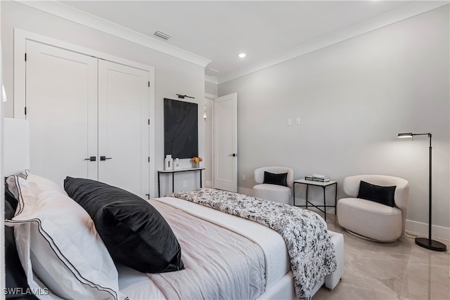 bedroom featuring a closet and crown molding