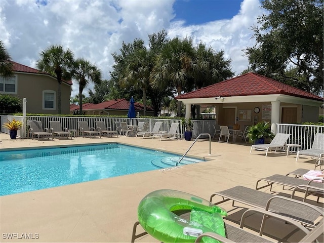 view of swimming pool with a patio area