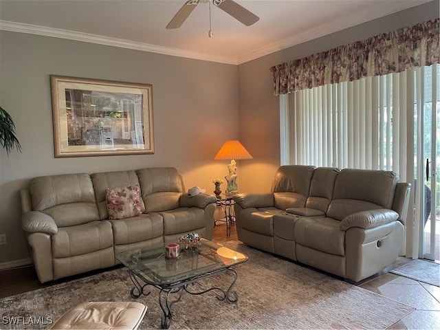 living room with ornamental molding and ceiling fan