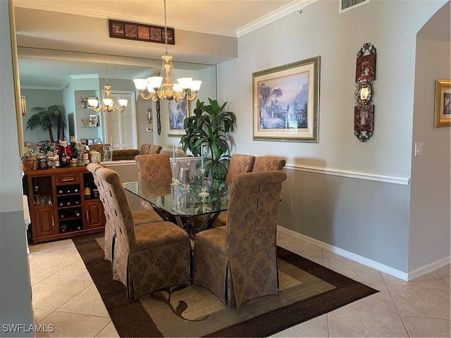 dining space with a notable chandelier, ornamental molding, and light tile patterned floors