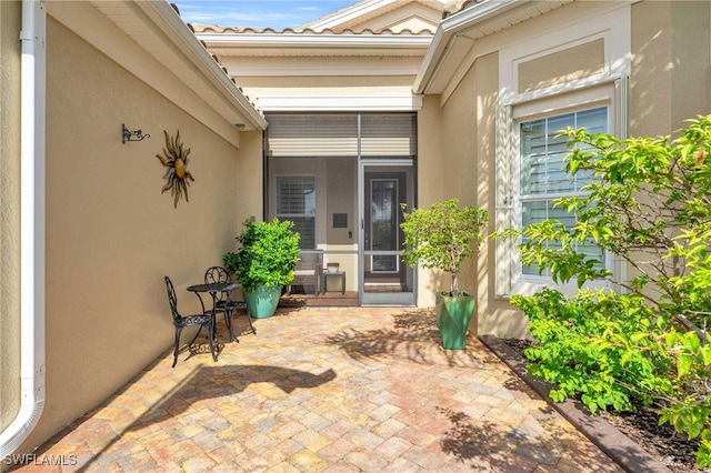 doorway to property with a patio