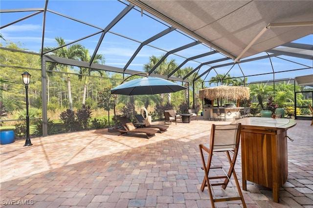 view of patio featuring a lanai