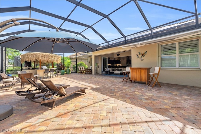 view of patio / terrace featuring a lanai