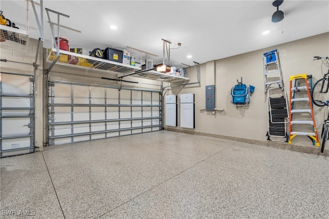 garage with electric panel and ceiling fan