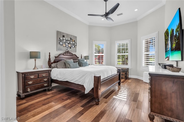 bedroom featuring dark wood-type flooring, a high ceiling, ornamental molding, and ceiling fan