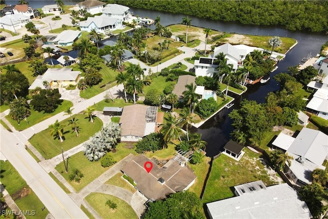 birds eye view of property with a residential view and a water view