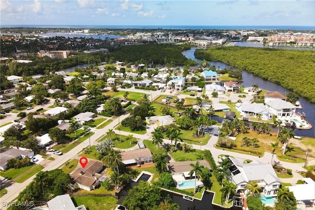 birds eye view of property featuring a water view