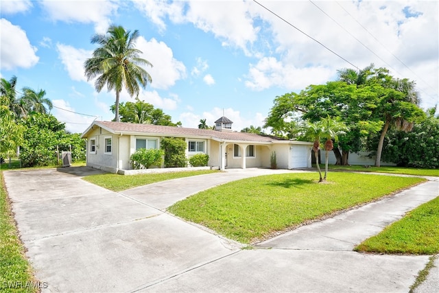 single story home with a front lawn and a garage