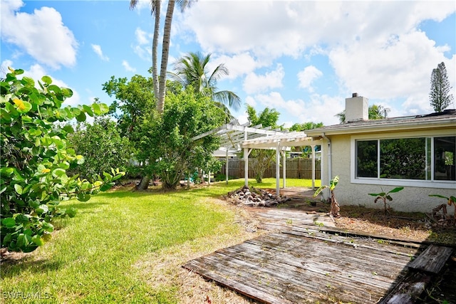 view of yard featuring a pergola and a wooden deck