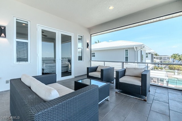 balcony featuring outdoor lounge area and french doors