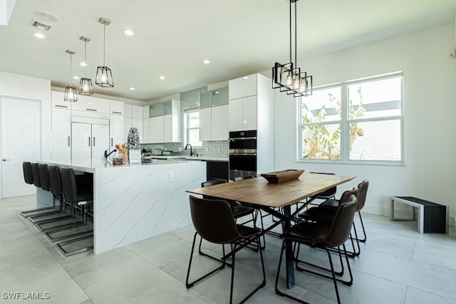 dining space featuring recessed lighting and visible vents