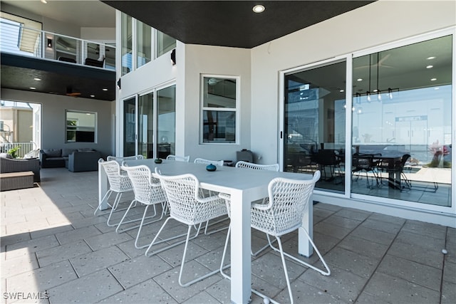 view of patio featuring outdoor dining area