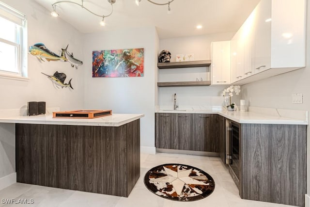 bar with wet bar and a sink