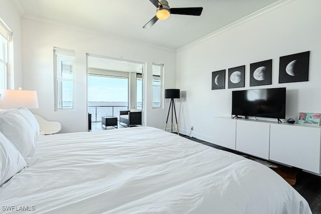 bedroom featuring ornamental molding, wood finished floors, a ceiling fan, and baseboards