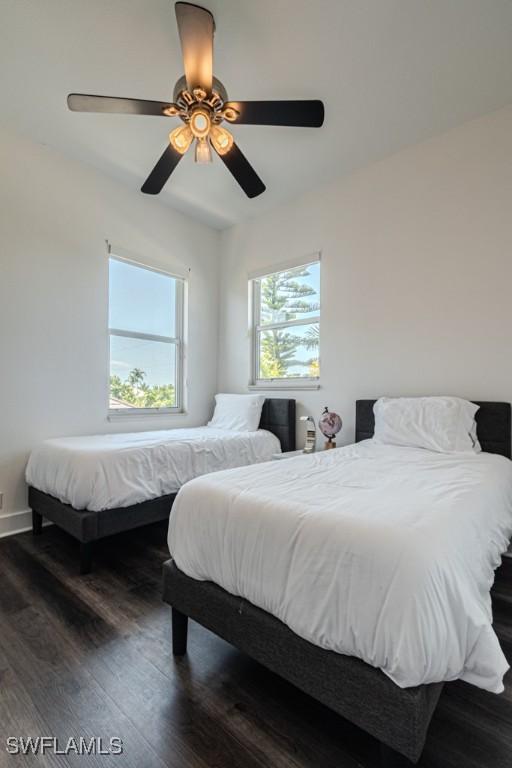 bedroom featuring dark wood-type flooring and ceiling fan