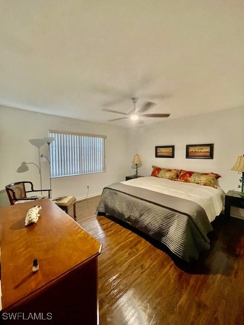 bedroom featuring dark wood-type flooring and ceiling fan