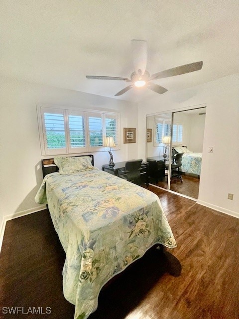 bedroom featuring a closet, ceiling fan, and dark hardwood / wood-style floors