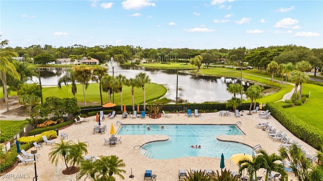 view of pool featuring a water view and a patio area