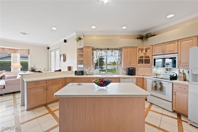 kitchen with white appliances, a wealth of natural light, and light tile patterned flooring