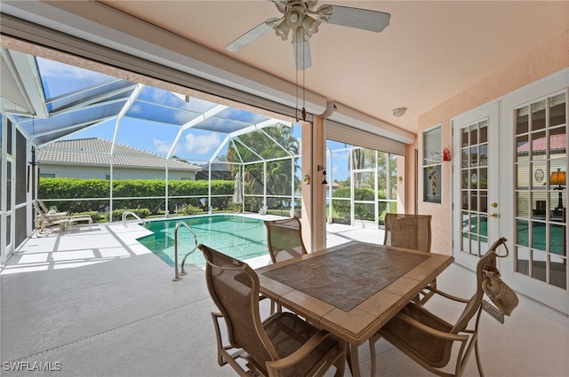 view of pool featuring french doors and ceiling fan