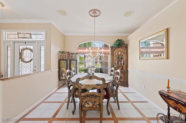 tiled dining area with ornamental molding, a chandelier, and a wealth of natural light