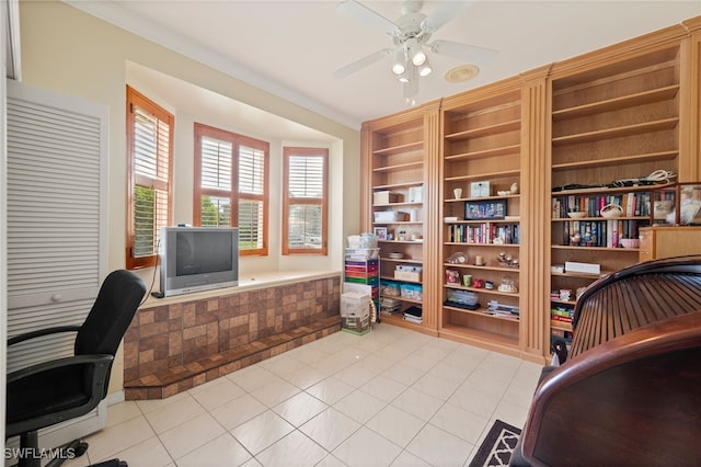 office area with built in features, ceiling fan, and light tile patterned flooring