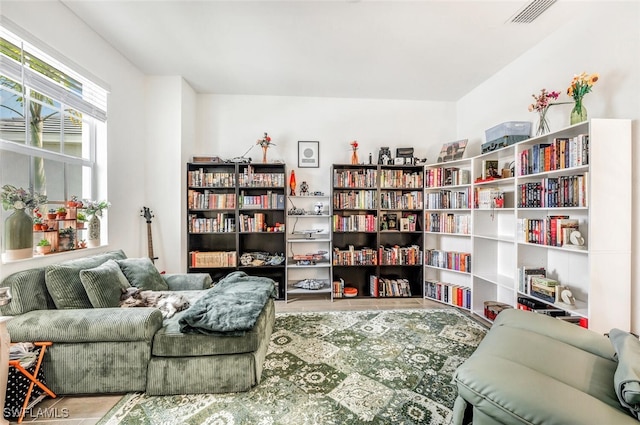 sitting room with hardwood / wood-style flooring