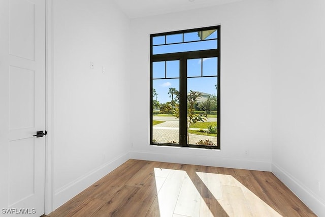 spare room with light hardwood / wood-style flooring