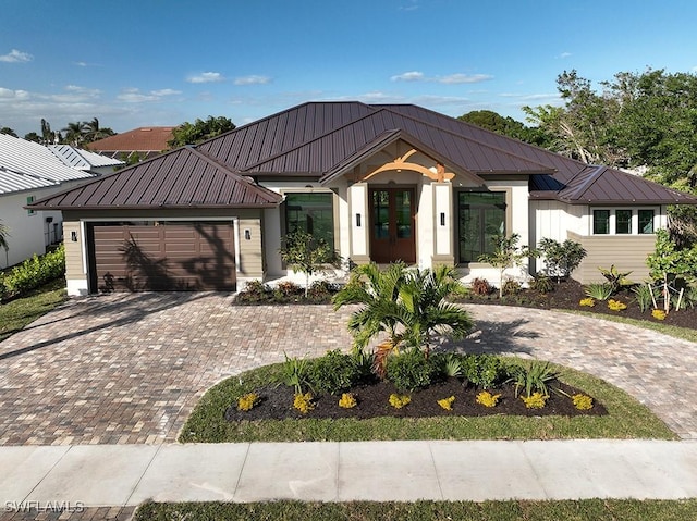 view of front of house featuring french doors and a garage